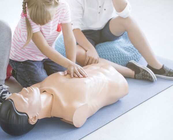Young girl performing cpr
