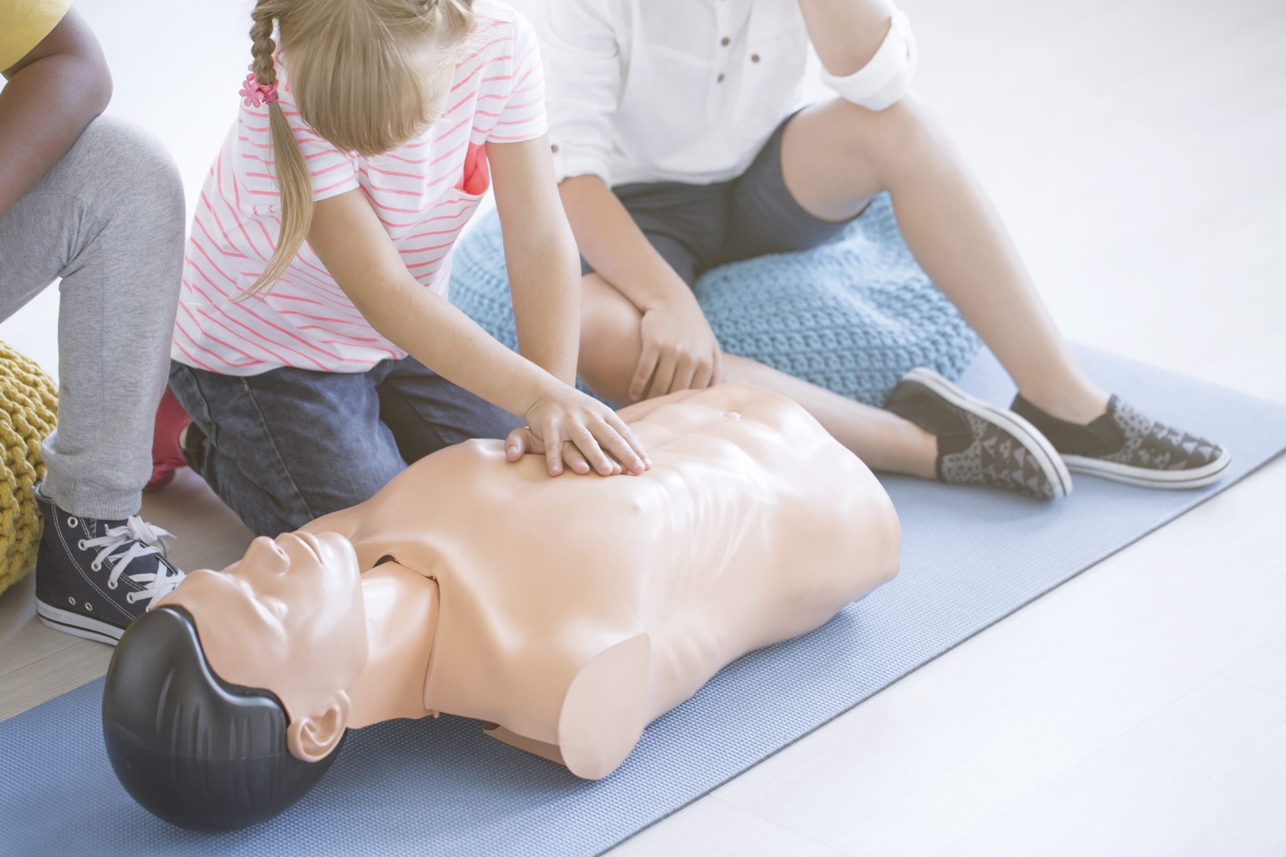 Young girl performing cpr