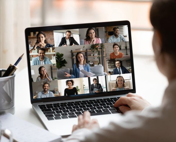 Female employee have webcam team meeting online